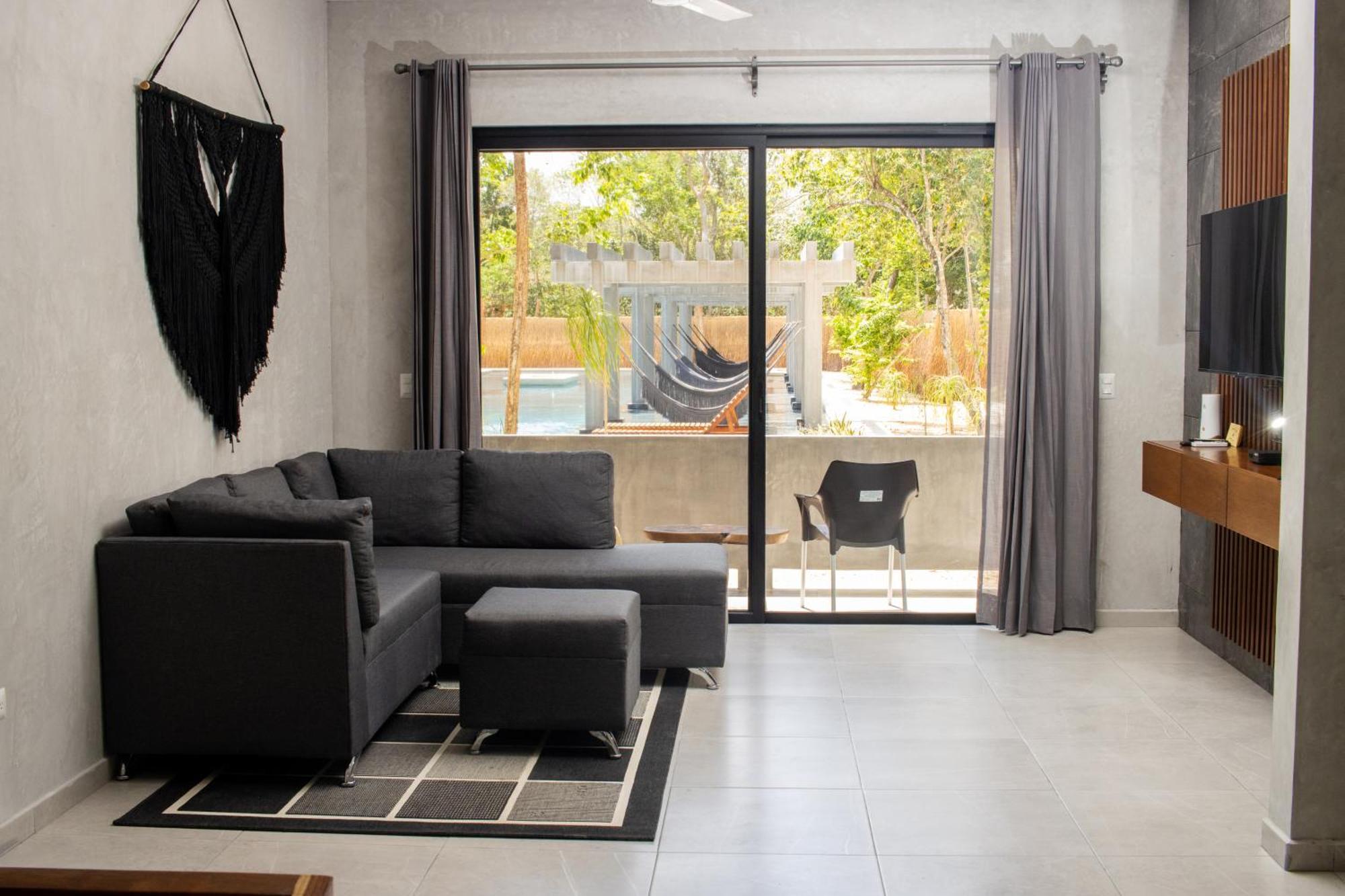 Hotel Casa Tortuga Tulum - Cenotes Park Inclusive Экстерьер фото A living room with a hammock